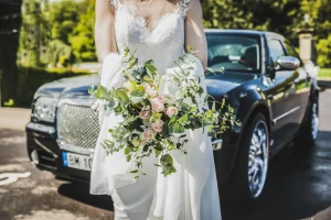 Zoomed image of a bride in a white gown inside Coach Corporate CarolinaLimo